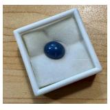 6.83 Carat Synthetic Blue Star Sapphire Oval Cabochon 6.83 Carat Synthetic Blue Star Sapphire Oval Cabochon