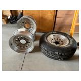 4 - 15" Alum Rims, 1 with Wild Country Radial XRT 235/75R15 4 - 15" Alum Rims, 1 with Wild Country Radial XRT 235/75R15