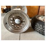 4 - 15" Alum Rims, 1 with Wild Country Radial XRT 235/75R15 4 - 15" Alum Rims, 1 with Wild Country Radial XRT 235/75R15