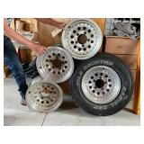 4 - 15" Alum Rims, 1 with Wild Country Radial XRT 235/75R15 4 - 15" Alum Rims, 1 with Wild Country Radial XRT 235/75R15