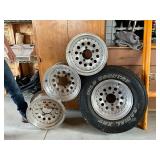 4 - 15" Alum Rims, 1 with Wild Country Radial XRT 235/75R15 4 - 15" Alum Rims, 1 with Wild Country Radial XRT 235/75R15