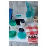 Lot of Household Items including Vinyl Tablecloth, Storage Containers, and Metal Ice Bucket