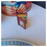 Christmas Decorations and Accessories - a Santa-themed tin, a decorative wood sign with a Nativity scene, and a "Faith Family Farming" snowman decoration