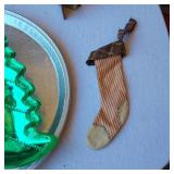 Christmas Decorations and Accessories - a Santa-themed tin, a decorative wood sign with a Nativity scene, and a "Faith Family Farming" snowman decoration