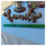 Decorative Home Items including Framed Art, Metal Jug, and Wooden Words