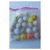 Mixed Sports Equipment Lot including Easton Hammer Bat, MacGregor Bat, Franklin Teeball Bat, Prince Tennis Racket, and Assorted Golf Balls