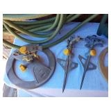 Garden Tools and Supplies including Hose Reel, Weed Barrier, and Sprinklers