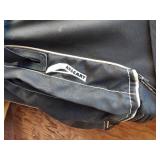 Golf equipment set including Johnny Miller Signature irons, wooden drivers, and a bag with assorted golf balls