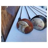 Golf equipment set including Johnny Miller Signature irons, wooden drivers, and a bag with assorted golf balls