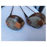 Golf equipment set including Johnny Miller Signature irons, wooden drivers, and a bag with assorted golf balls