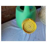 Assorted Planters and Garden Tools including Decorative Clay Pot, Watering Can, and Hose Nozzle