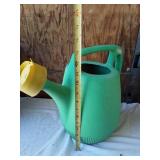 Assorted Planters and Garden Tools including Decorative Clay Pot, Watering Can, and Hose Nozzle