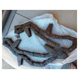 Assorted Farm Parts and Tools including Chains, Clamps, and Drill Bits