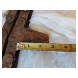 Assorted Farm Parts and Tools including Chains, Clamps, and Drill Bits