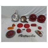 Assorted Automotive Parts including Broken Pontiac Emblem, Guide R8-50 Light, and Various Lenses