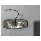 Assorted Automotive Parts including Broken Pontiac Emblem, Guide R8-50 Light, and Various Lenses