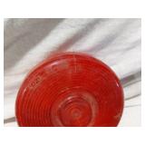 Assorted Automotive Parts including Broken Pontiac Emblem, Guide R8-50 Light, and Various Lenses