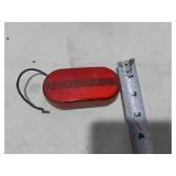 Assorted Automotive Parts including Broken Pontiac Emblem, Guide R8-50 Light, and Various Lenses