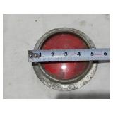Assorted Automotive Parts including Broken Pontiac Emblem, Guide R8-50 Light, and Various Lenses