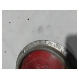Assorted Automotive Parts including Broken Pontiac Emblem, Guide R8-50 Light, and Various Lenses