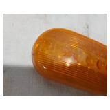 Assorted Automotive Parts including Broken Pontiac Emblem, Guide R8-50 Light, and Various Lenses