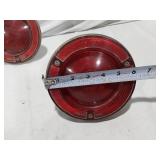 Assorted Automotive Parts including Broken Pontiac Emblem, Guide R8-50 Light, and Various Lenses