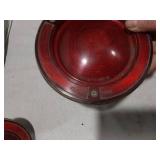 Assorted Automotive Parts including Broken Pontiac Emblem, Guide R8-50 Light, and Various Lenses