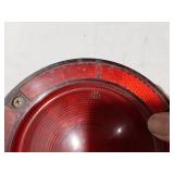 Assorted Automotive Parts including Broken Pontiac Emblem, Guide R8-50 Light, and Various Lenses