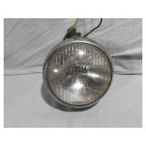 Assorted Automotive Parts including Broken Pontiac Emblem, Guide R8-50 Light, and Various Lenses