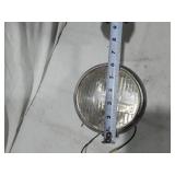 Assorted Automotive Parts including Broken Pontiac Emblem, Guide R8-50 Light, and Various Lenses