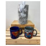 A themed Superman lot featuring two oversized mugs and a collectible 2016 Blue Line Superman figure in sealed packaging. A themed Superman lot featuring two oversized mugs and a collectible 2016 Blue Line Superman figure in sealed packaging.