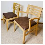 Two Wooden Dining Chairs with Vinyl Upholstered Cushions Two Wooden Dining Chairs with Vinyl Upholstered Cushions
