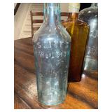 Collection of Vintage Glass Bottles with Embossed Text Collection of Vintage Glass Bottles with Embossed Text