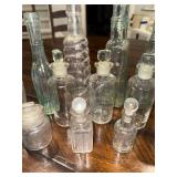 Vintage Collection of 14 French and English Assorted Glass Bottles with Stoppers Vintage Collection of 14 French and English Assorted Glass Bottles with Stoppers