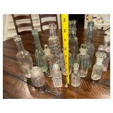 Vintage Collection of 14 French and English Assorted Glass Bottles with Stoppers Vintage Collection of 14 French and English Assorted Glass Bottles with Stoppers