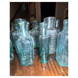 Lot of Antique English Embossed Apothecary Glass Bottles Lot of Antique English Embossed Apothecary Glass Bottles
