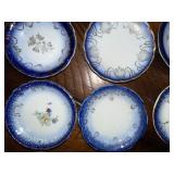 Antique French Flow Blue Butter Pat Plates Set of 11 with Gold Detailing Antique French Flow Blue Butter Pat Plates Set of 11 with Gold Detailing