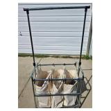 Tri-pocket Laundry Cart full of clothes-hangers Tri-pocket Laundry Cart full of clothes-hangers