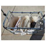 Tri-pocket Laundry Cart full of clothes-hangers Tri-pocket Laundry Cart full of clothes-hangers