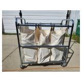Tri-pocket Laundry Cart full of clothes-hangers Tri-pocket Laundry Cart full of clothes-hangers