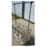 Tri-pocket Laundry Cart full of clothes-hangers Tri-pocket Laundry Cart full of clothes-hangers