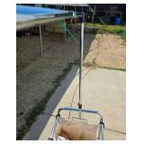 Tri-pocket Laundry Cart full of clothes-hangers Tri-pocket Laundry Cart full of clothes-hangers