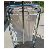 Tri-pocket Laundry Cart full of clothes-hangers Tri-pocket Laundry Cart full of clothes-hangers