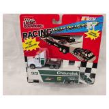 (3) 1/64 Scale Nascar Transporters and (1) Mini Transporter