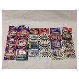 (18) 1/64 Scale Nascar Collectables with Display Stand and Trading Cards