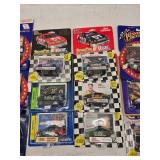 (18) 1/64 Scale Nascar Collectables with Display Stand and Trading Cards
