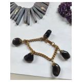 Collection of Gemstone Necklaces and Bracelets with Amethyst, Rose Quartz, Onyx, and Shell Accents