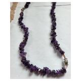 Collection of Gemstone Necklaces and Bracelets with Amethyst, Rose Quartz, Onyx, and Shell Accents