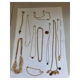 Collection of 10 Gold Tone Costume Jewelry Necklaces with Charms