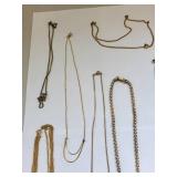 Collection of 10 Gold Tone Costume Jewelry Necklaces with Charms